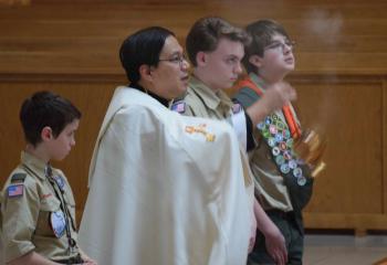 Father Eric Tolentino at the benediction of the Blessed Sacrament. (Photo by John Simitz)