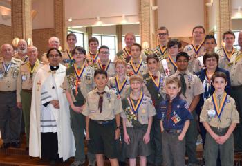 Gathering at the ceremony are, from left: front, Sebastian Malaver, Evan Houser, Benjamin Mickulik and Liam Damitz; second row, Father Eric Tolentino, Stephen Beck III, Conor Christ, William Mickulik, Supreeth Dmello and Joanne Loeper; third row, Bill Brodniak, Fred Flemming, Nathan Wilson, Christopher Trubilla, Robert Hudopohl, Rhaife Combs and Todd McGreggor; back, Bill Minford, Bernard Hofmann, Brendan Christ, Christian Dunlap, Christopher Kochel, Keith Nedidig, Ed Miller and Seamus McGee.