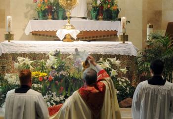 Bishop Schlert incenses the altar and the monstrance containing the Blessed Sacrament at St. Joseph the Worker, Orefield.