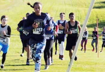 Runners head up the incline part of the course during the seventh- and eighth-grade boys’ and girls’ race.  The girls’ team from Our Lady of Perpetual Help, Bethlehem won first place and the boys’ team from St. Jane placed first.