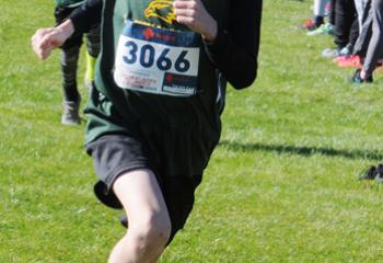 Aiden Vanwert, St. Jane, runs toward the finish line to win the fifth- and sixth-grade boys’ race. The team from St. Thomas More earned first place in the boys’ race.