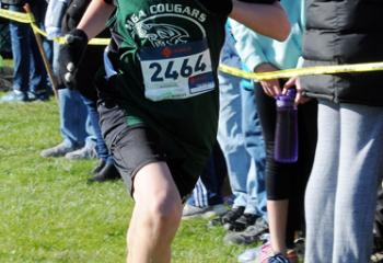 Shawn Swavely from HGA sprints toward the finish line to win the fifth- and sixth-grade boys’ race.